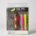 Load image into Gallery viewer, SAC PIG Bait Co. fishing lure packaging with a brown lure, pink and yellow trailers, and brand name on a gray background.